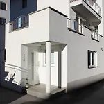 Modern In At Bus Stop *